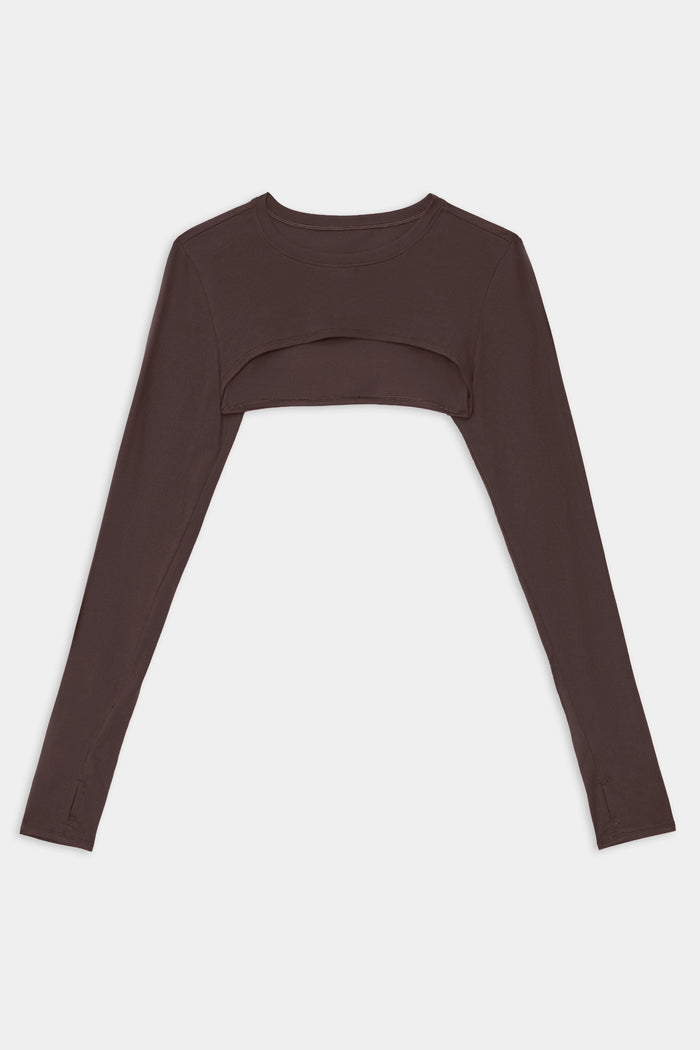 The SPLITS59 Amelia Airweight Lite Shrug in Dark Chocolate is a long-sleeve, cropped top with an open front and crew neckline, shown laid flat on a white background.