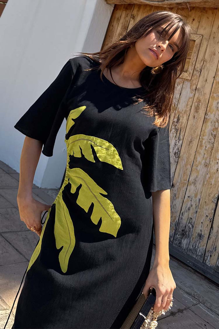 Black Palm Riviera Dress in a cotton blend with a lime palm motif and adjustable side tie detailing.