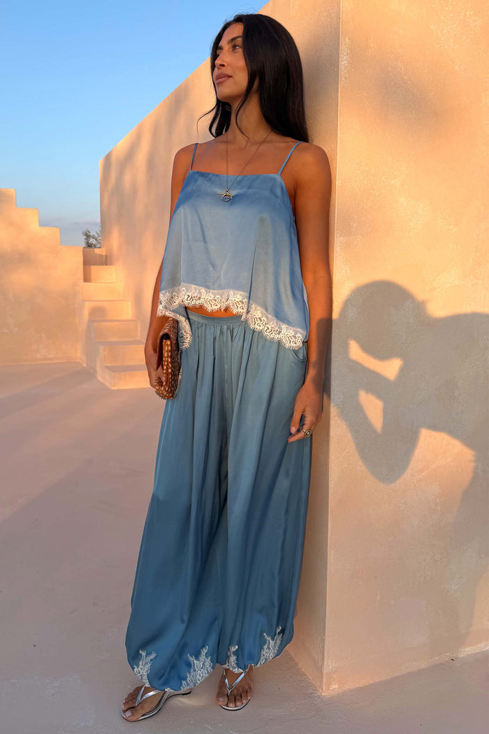 Blue Lace Balloon Trousers in washed blue satin with lace trims at the hem, styled as a co-ord on a model.