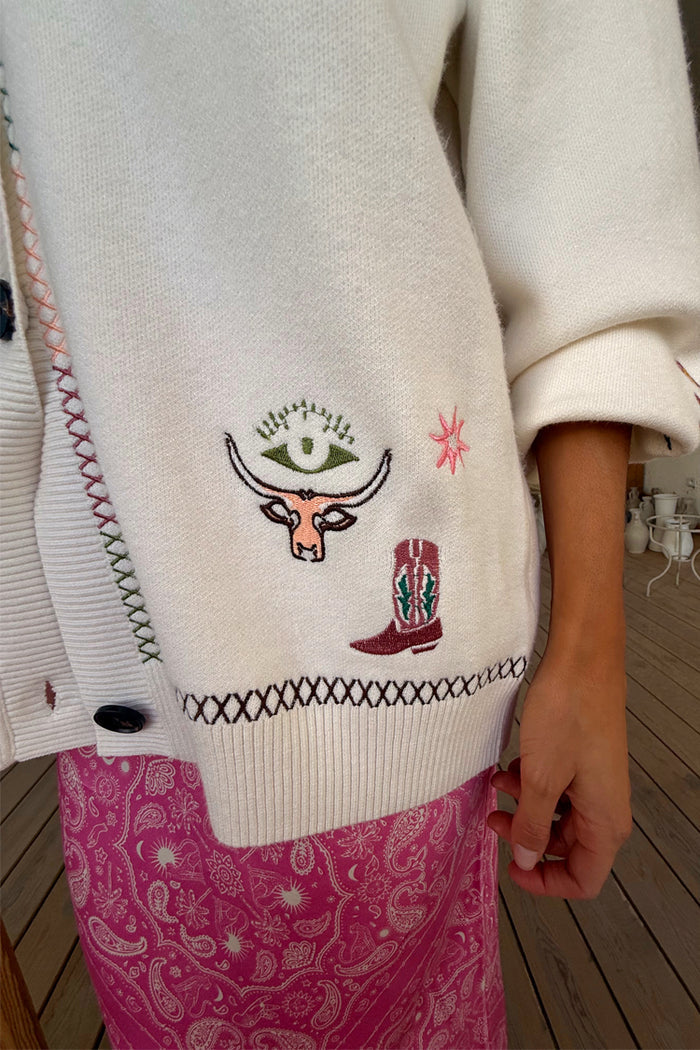 Cream Western Martha Cardigan featuring embroidered western motifs and colourful criss cross stitch detailing on soft knit.