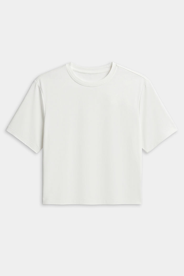 The SPLITS59 Djuna Oversized Jersey Tee in white features a short-sleeve, crew neck design—ideal for gym or outdoor workouts. Shown laid flat on a white background.