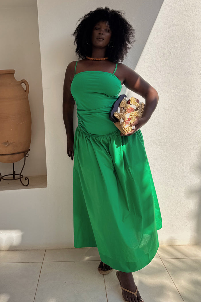 Green Lola Mid-axi Dress with ruched side seams and a breathable cotton skirt.