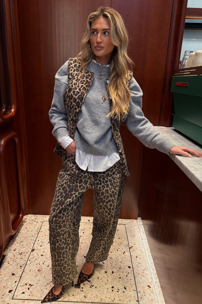 Iconic cotton Leopard Waistcoat layered over a grey jumper and matching barrel jeans for a statement London look.