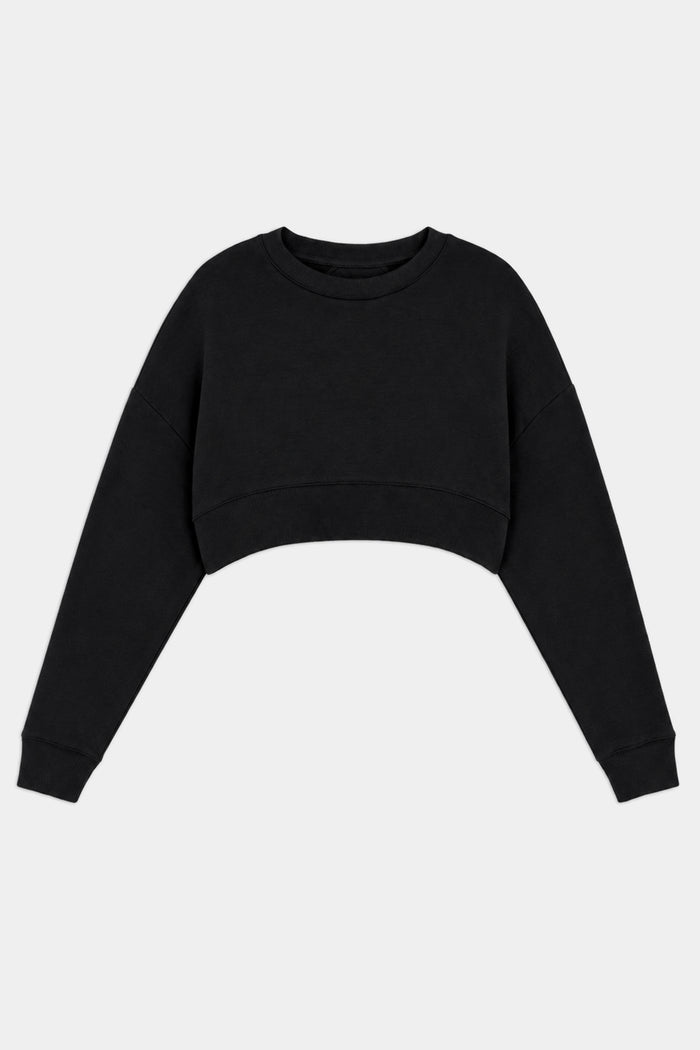 The SPLITS59 Noah Fleece Crop Sweatshirt in black features long sleeves, a crew neckline, and dance-inspired design—made in Los Angeles and shown flat on a white background.