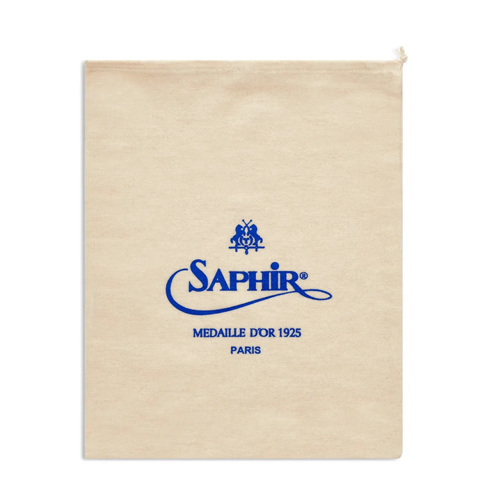 A beige cotton shoe bag with the Saphir Medaille d'Or logo printed in blue.