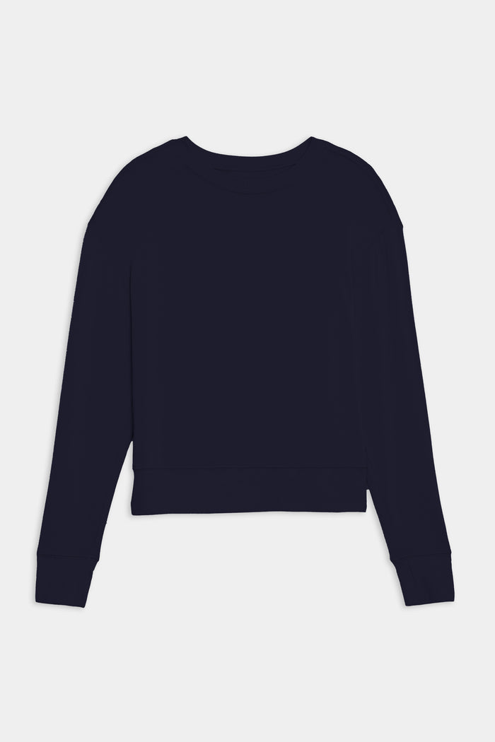 The SPLITS59 Sonja Fleece Sweatshirt in indigo, a long-sleeve crewneck pullover crafted from ultra luxe fleece, is shown laid flat from the back on a white background. MADE IN LOS ANGELES.