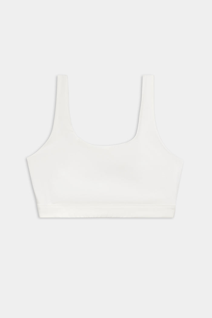 The SPLITS59 Sprint Rigor Bra - White is a sleeveless sports bra with a scoop neckline, perfect for gym workouts and multi-sport performance, showcased on a plain light background.