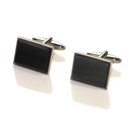 A pair of black rectangular oxhorn cufflinks with a rhodium finish and a swivel barrel design.