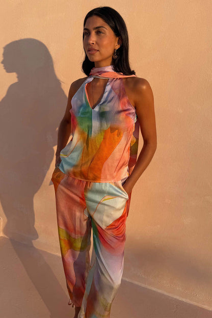 Abstract Lily Top in a multicoloured satin-esque print with a multi-wear tie-neck, styled as a co-ord.