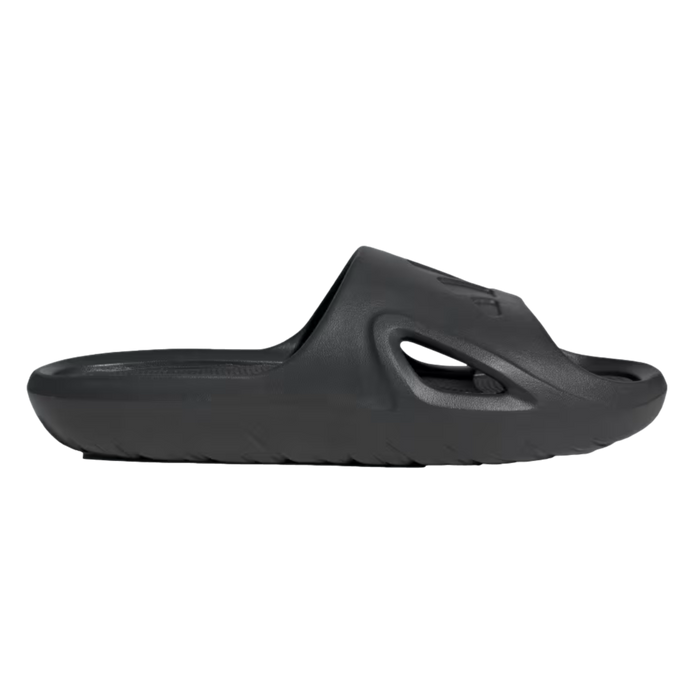 Profile view of a single all-black slide sandal featuring a thick, contoured sole and a side cutout on the strap.
