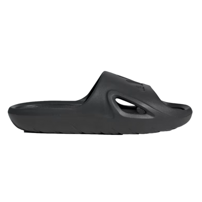 Profile view of a single all-black slide sandal featuring a thick, contoured sole and a side cutout on the strap.