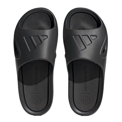 Top-down view of black Adidas slides with the embossed logo on the strap and "END PLASTIC WASTE" printed on the footbed.