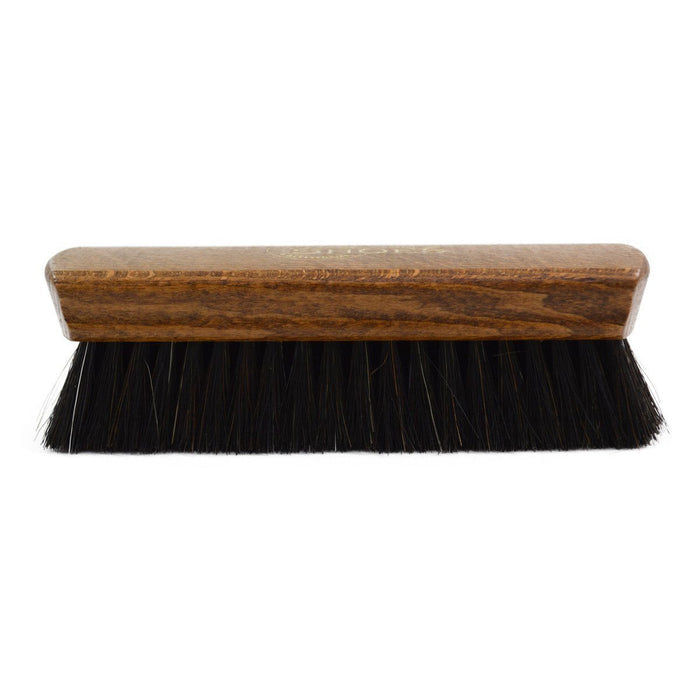 A wooden shoe shine brush with horsehair bristles, one with the brand 'AFPOS' visible on the top.