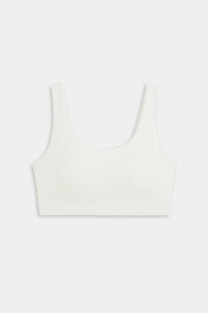 The SPLITS59 Airweight Rib Bra in white features wide straps and a scoop neckline, crafted from ribbed airweight fabric for comfort—ideal for hot yoga. Shown laid flat on a plain light background.