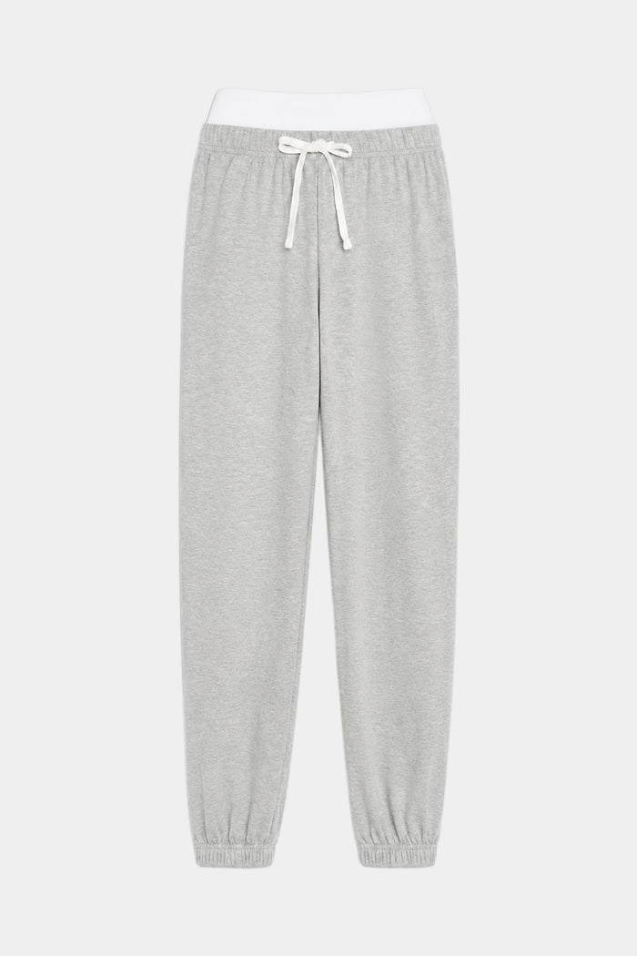 The SPLITS59 Andie Dual Waist Sweatpant in Heather Grey/White features a soft modal spandex blend, white elastic waistband, white drawstring, and elastic cuffs, shown laid flat on a plain background.