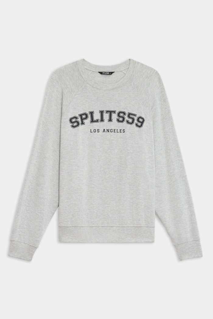 The SPLITS59 Andie Oversized Fleece Varsity Graphic Sweatshirt in Heather Grey features "SPLITS59 LOS ANGELES" printed on the front, with long sleeves and ribbed cuffs. Made in Los Angeles for a classic, cozy look.