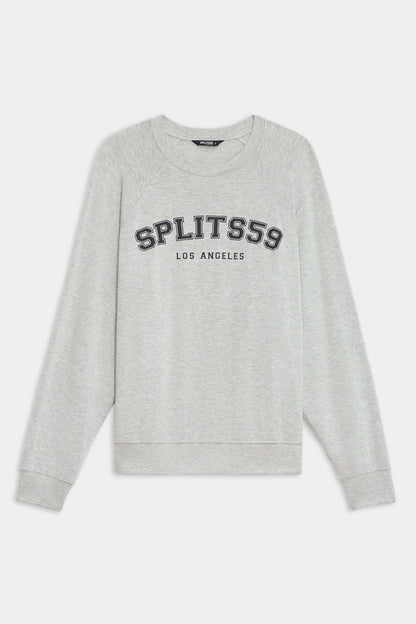 The SPLITS59 Andie Oversized Fleece Varsity Graphic Sweatshirt in Heather Grey features "SPLITS59 LOS ANGELES" printed on the front, with long sleeves and ribbed cuffs. Made in Los Angeles for a classic, cozy look.