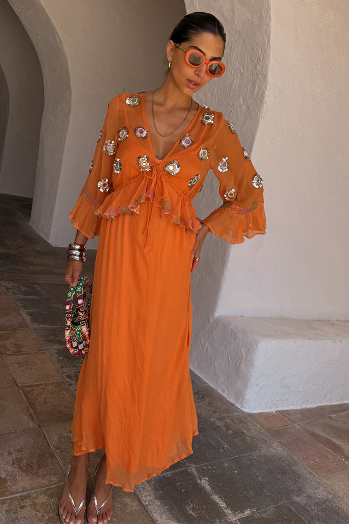 Apricot Embellished Ines Dress in orange featuring mirror detailing, a peplum hem, and hand embroidery.