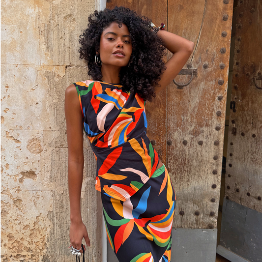 Banana A-Symmetric jersey top with multicoloured motifs, cinched waist, and matching co-ord skirt.