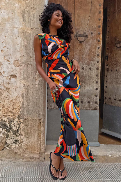 Banana A-Symmetric Top and matching skirt with vibrant multicoloured banana motifs on a black jersey base.