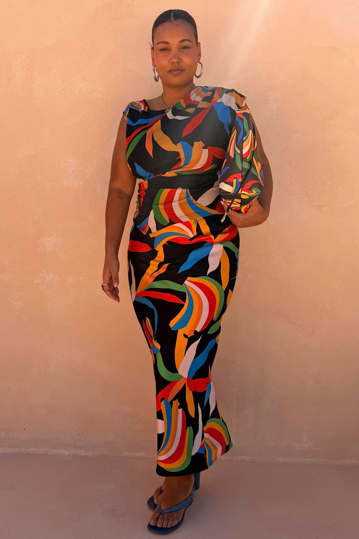 Banana Dorris Skirt in a multicoloured hand-painted print on black jersey, styled as a midi co-ord for inclusive sizing.