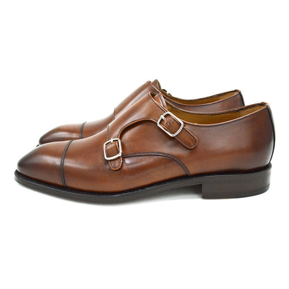 A brown Berwick 1707 double monk shoe with double buckle monk strap on a white background.