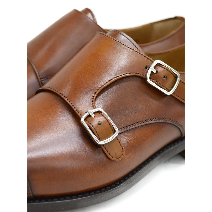 A brown Berwick 1707 double monk shoe with double buckle monk strap on a white background.