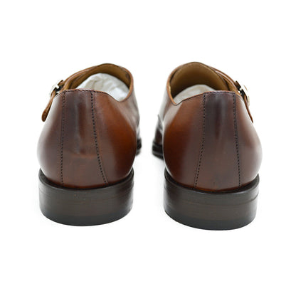 A brown Berwick 1707 double monk shoe with double buckle monk strap on a white background.