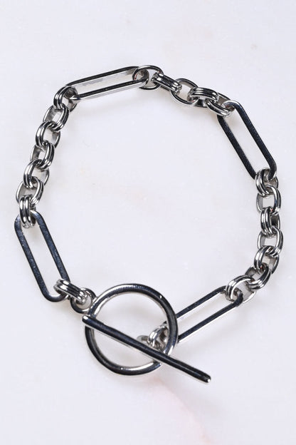Bespoke silver chain bracelet with mixed links and a T-bar fastening.