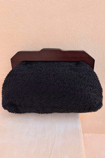 Black Beaded Mirror Bag featuring intricate glass beadwork and a dark brown wooden handle.