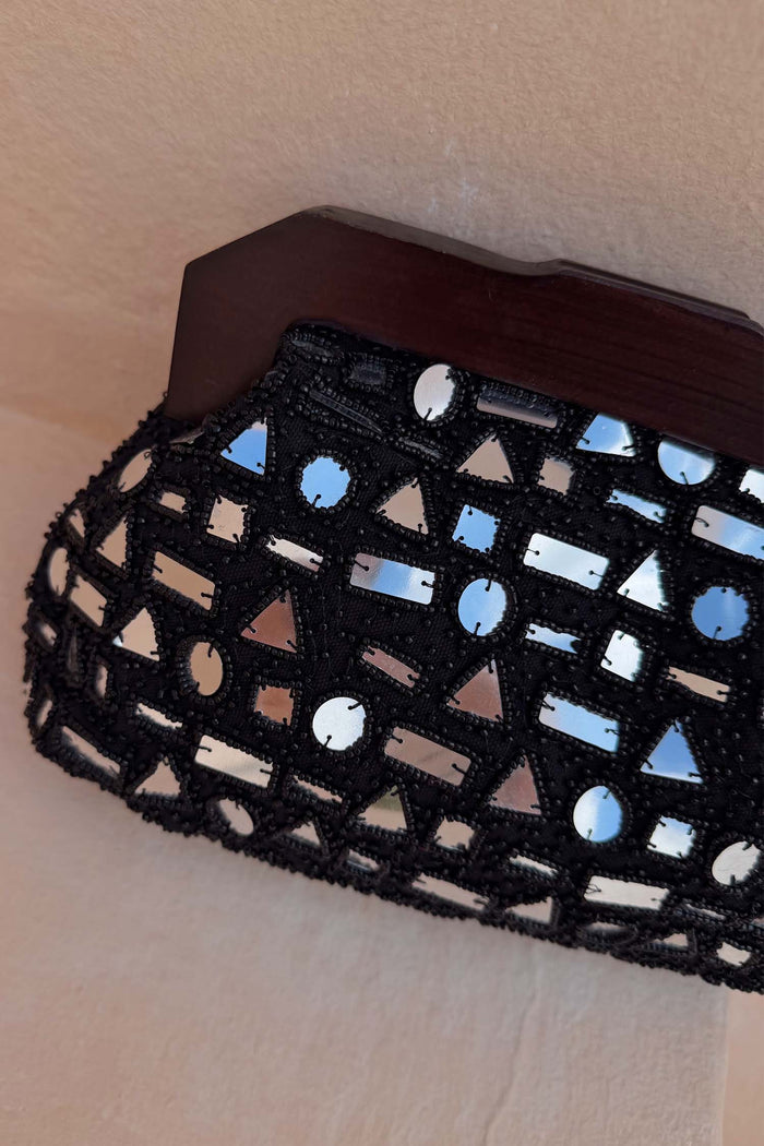 Black Beaded Mirror Bag with silver geometric glass embellishments and a dark wooden top handle.