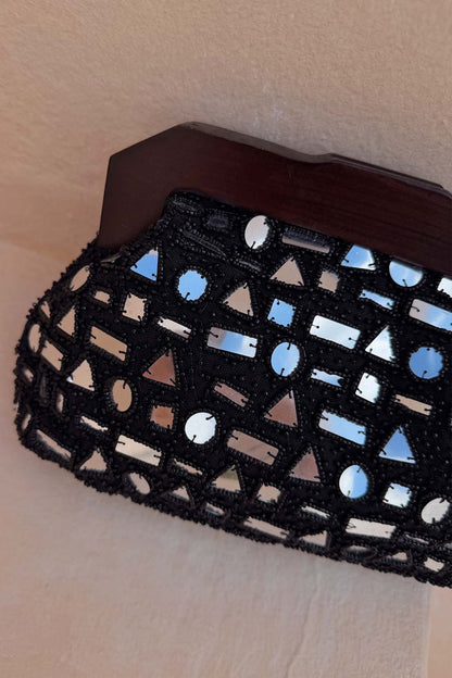 Black Beaded Mirror Bag with silver geometric glass embellishments and a dark wooden top handle.