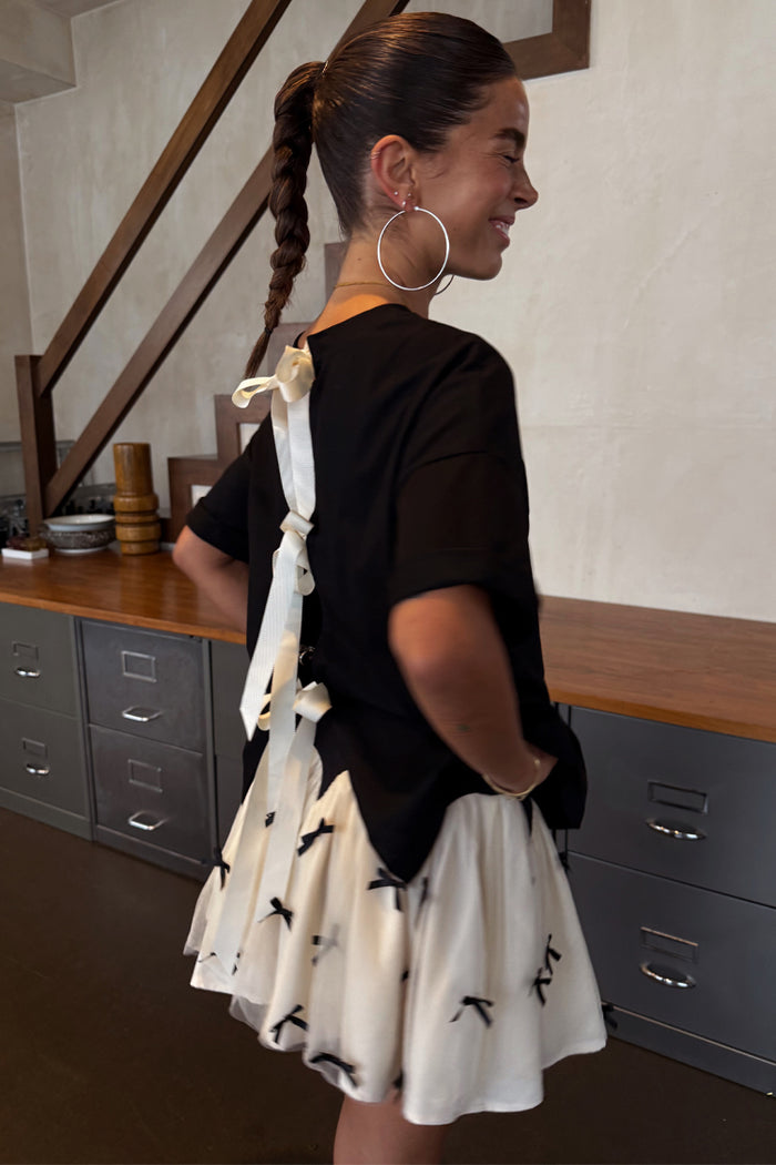 Black Bow Back T-Shirt featuring cream ribbon fastenings on the back and dropped hem shoulders.