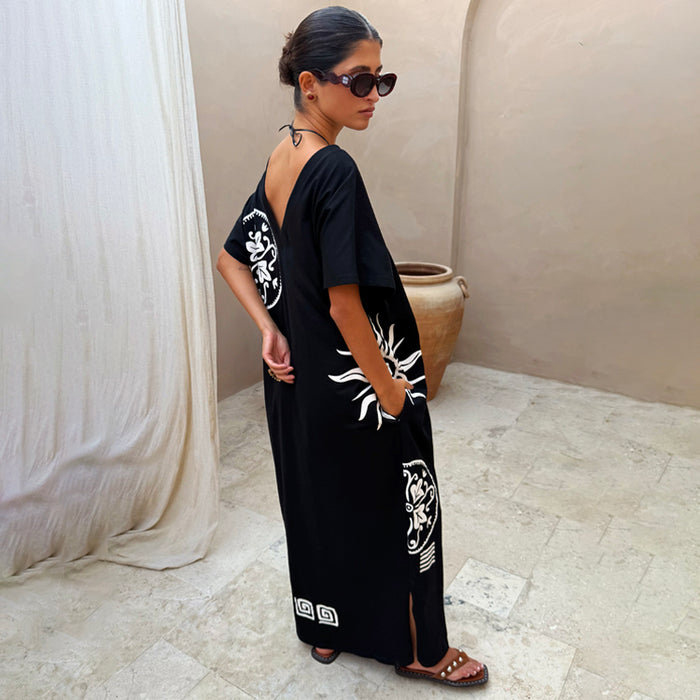 Black Dolce Vita cotton t-shirt dress with iconic sun motifs and hand-painted Greek-inspired graphics.