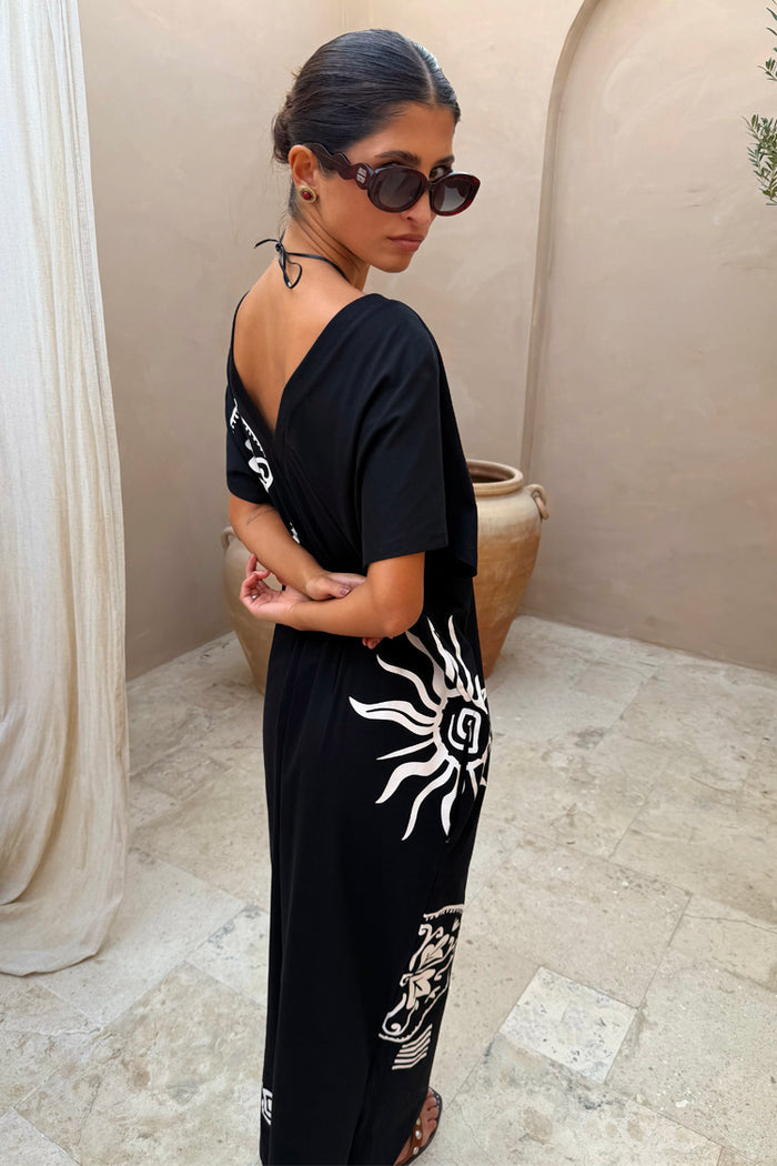 Black cotton Dolce Vita T-Shirt Dress featuring white sun motifs and Greek-inspired graphics.
