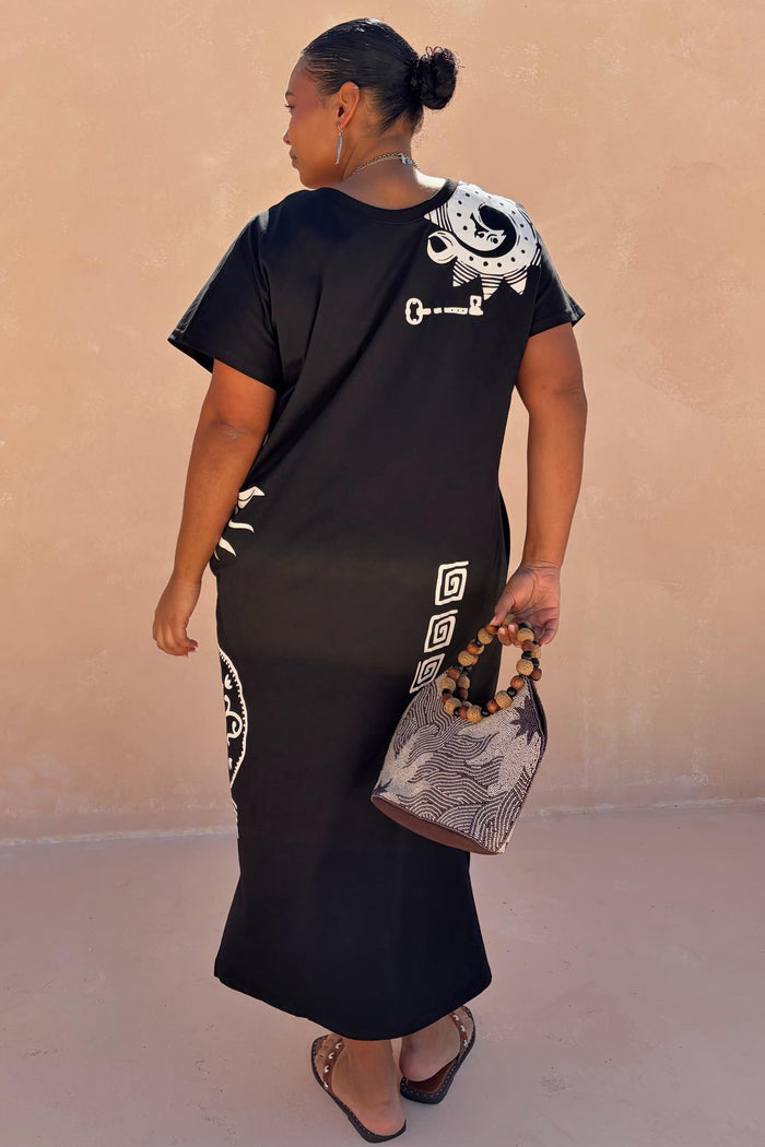 Black Dolce Vita T-Shirt Dress featuring white hand-painted sun motifs and Greek graphics on a cotton maxi.