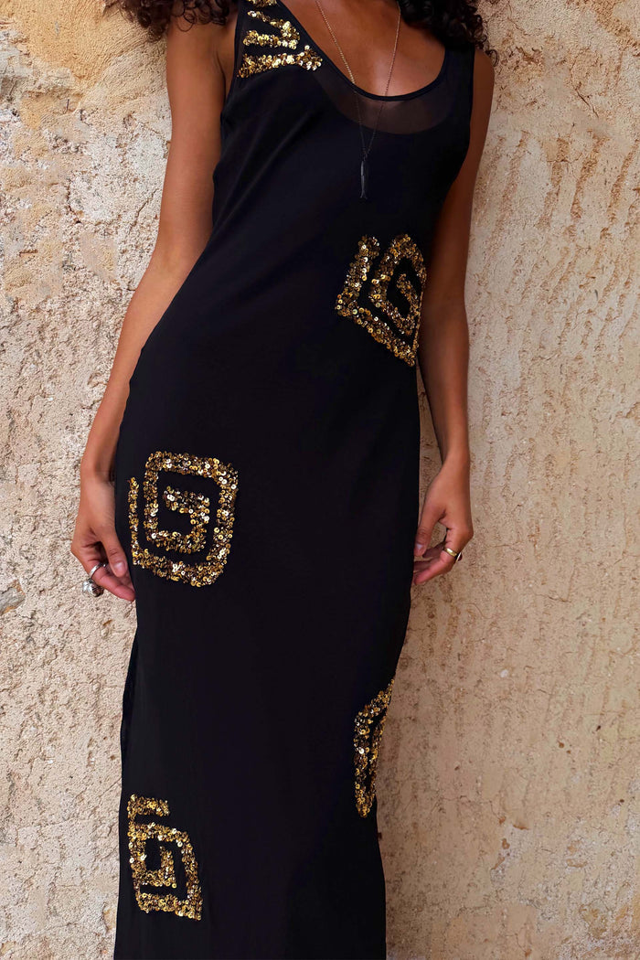Black & Gold Simona Maxi Dress with geometric sequin patterns and a sheer mesh scoop neckline.