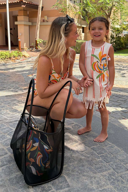 Black Mesh Tote Bag with leather straps and banana print pouch, shown with a woman and child in matching outfits.