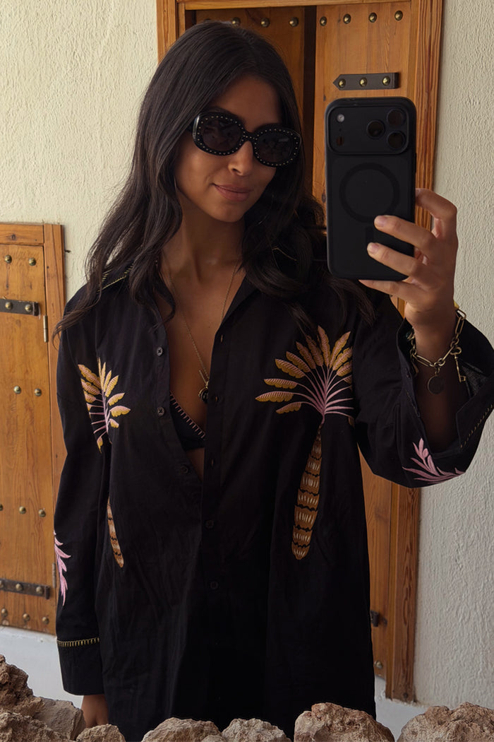 Black Palm Embroidered Shirt with pink palm motifs and whipstitch collar, worn by a model in a mirror selfie.