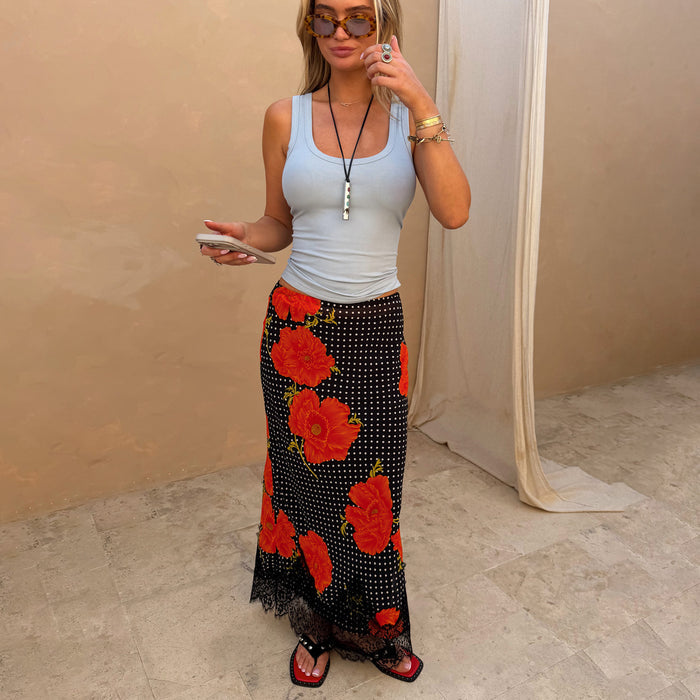 Black Poppy Midi Maeva Skirt in an iconic red floral and polka dot print with a black lace border.
