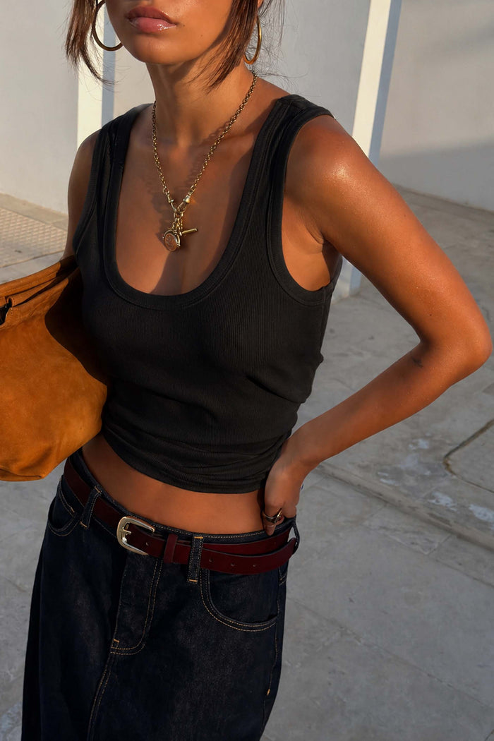 Black Scoop Neck Rib Tank in soft stretch ribbed fabric, a capsule wardrobe staple styled with denim and gold jewellery.