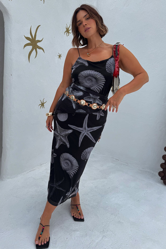 Black Seashell Mesh Cami Dress with a white starfish and shell print, styled with a gold disc belt.