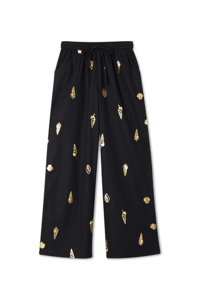 Black Shell Elissa Trousers with a gold metallic shell print, wide-leg silhouette and elasticated drawstring waist.