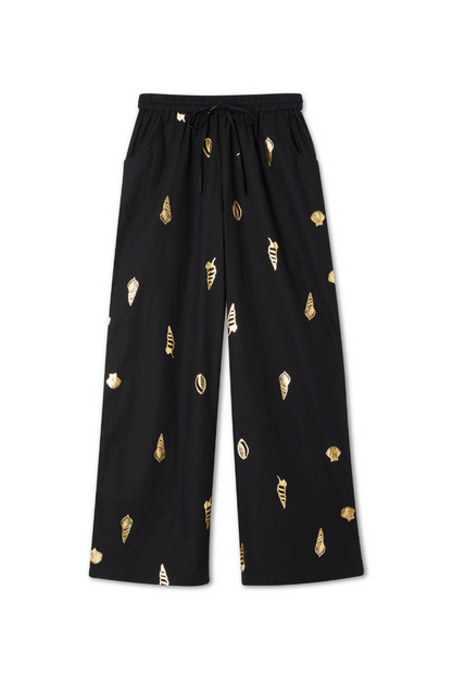 Black Shell Elissa Trousers with a gold metallic shell print, wide-leg silhouette and elasticated drawstring waist.