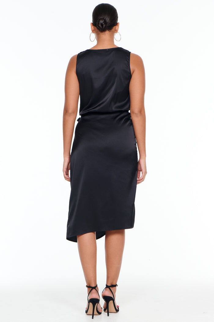 Black Sleeveless Vienna Dress in satin, a midi-length wardrobe staple shown from the back on a model.