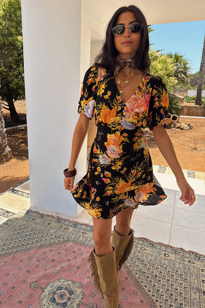 Black Sofia Mini Tea Dress with an orange and blue floral print, v-neckline and frill hem detail.