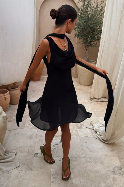 Black Sophie Mini Dress with a cowl neckline and detachable scarf, showcasing the fluid bias-cut and multi-wear style.