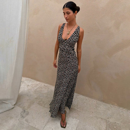 Black Spot Boni Dress with red and white spot print, featuring a deep V-neckline and bias-cut midi silhouette on a model.