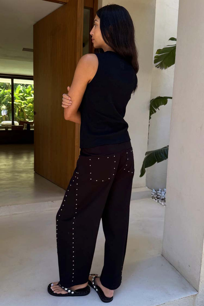 Black Studded Barrel Jeans featuring a barrel leg and silver studs along the sides and back pockets.
