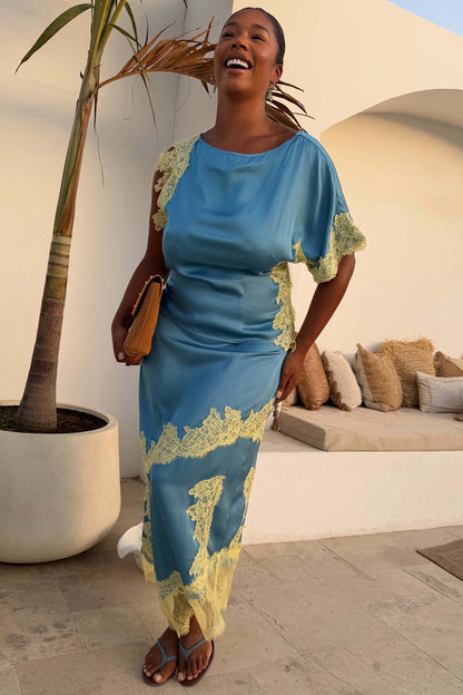 Blue and Lemon Millie Skirt with asymmetric lace detailing and matching top on a model in a sunlit patio setting.
